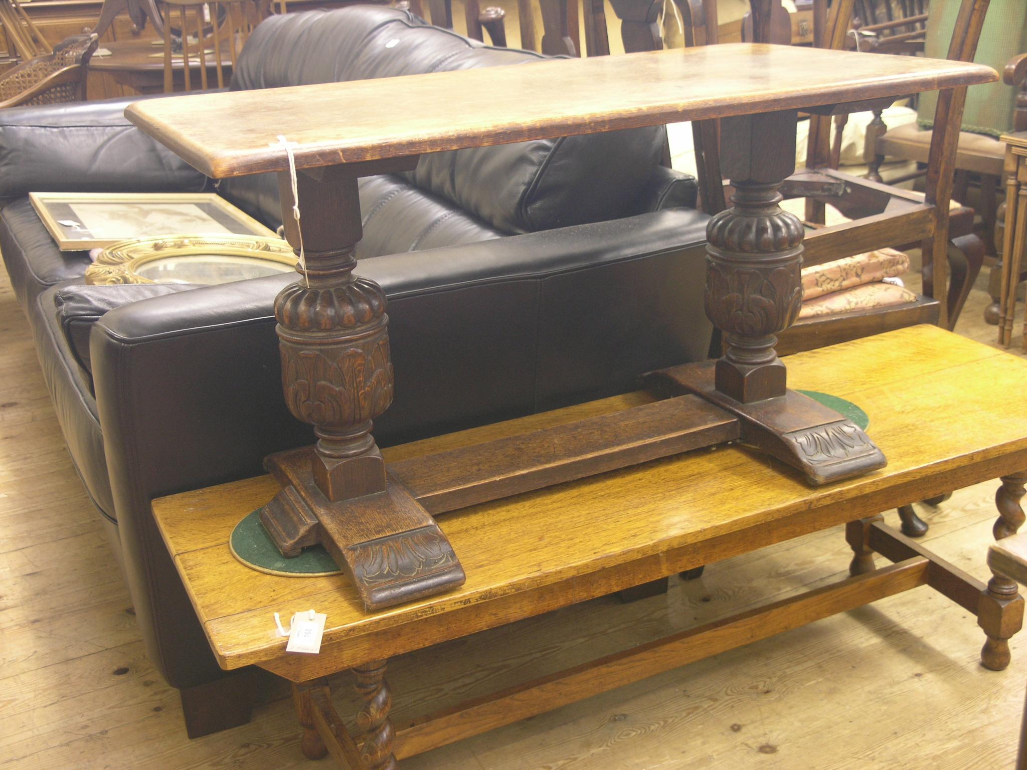 Appraisal: A solid dark oak coffee table rectangular top on Elizabethan-style