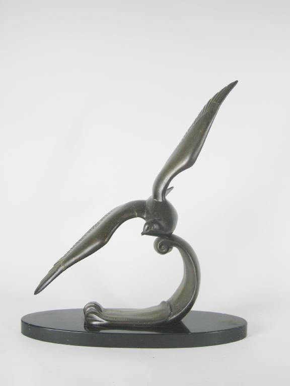 Appraisal: A bronzed Spelter Figure of a Bird on polished slate