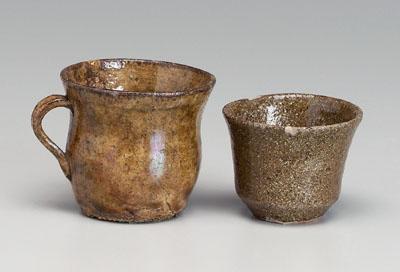 Appraisal: Two alkaline glaze stoneware cups one with everted rim strap