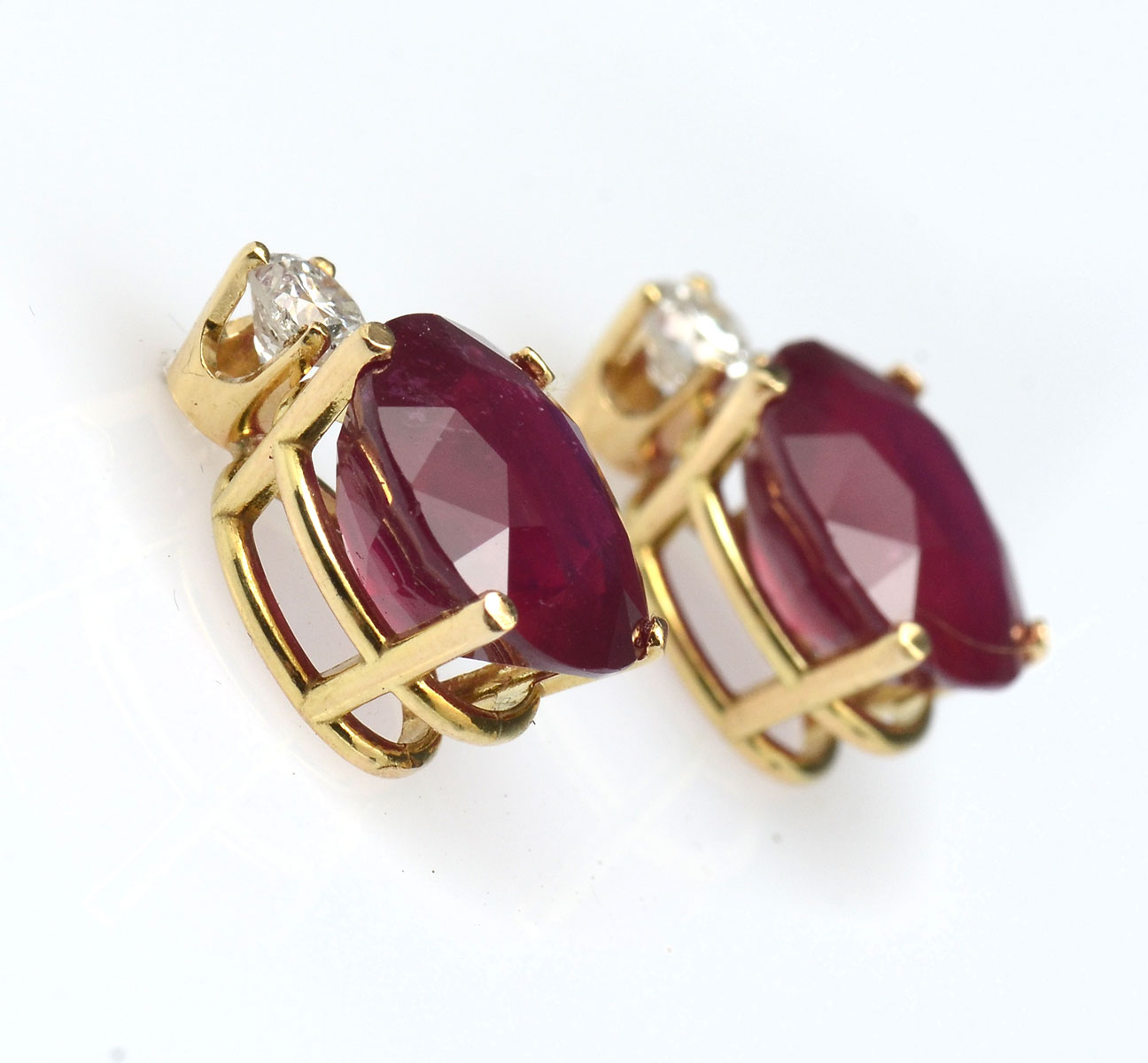 Appraisal: K RUBY DIAMOND EARRINGS K yellow gold earrings contain oval