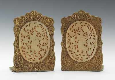 Appraisal: A Pair of Cast Bronze and Carved Hardstone Bookends A