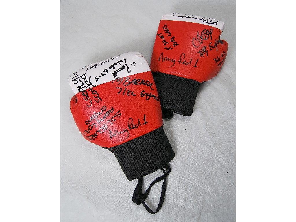 Appraisal: A pair of 'Army Red ' boxing gloves signed by