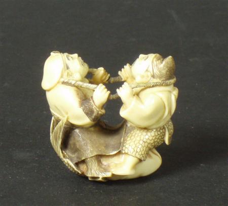 Appraisal: A Japanese ivory netsuke Probably Meiji period depicting two men