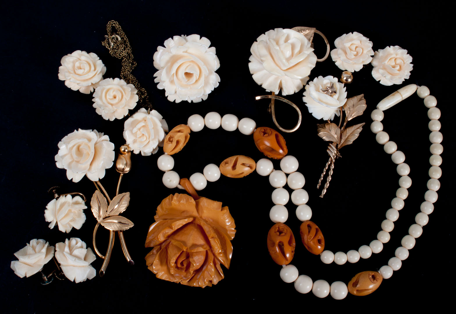 Appraisal: Group of carved ivory rose bud jewelry items including four