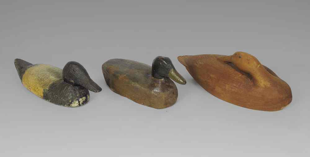 Appraisal: GROUP OF WORKING DECOYS WITH GLASS EYES Primitive in style