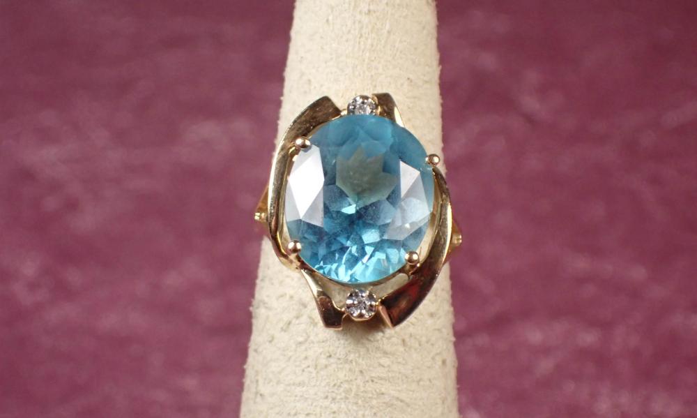 Appraisal: BLUE TOPAZ DIAMOND AND FOURTEEN KARAT GOLD RING The yellow