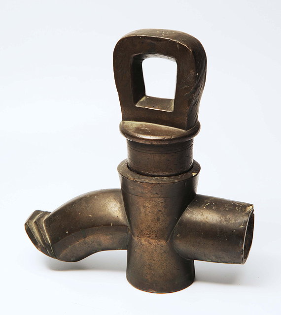 Appraisal: AN EASTERN POSSIBLY CHINESE HEAVY BRONZE TAP with ring handle