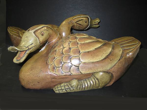 Appraisal: A pair of Thai carved and painted wood swans The