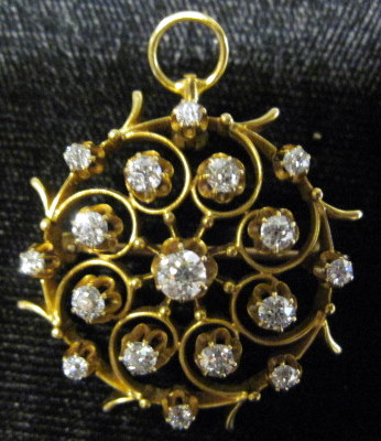 Appraisal: Yellow gold diamond pinRound foliate motif displaying sixteen petite round