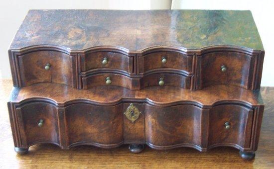 Appraisal: A Queen Anne walnut miniature chest of drawers with a