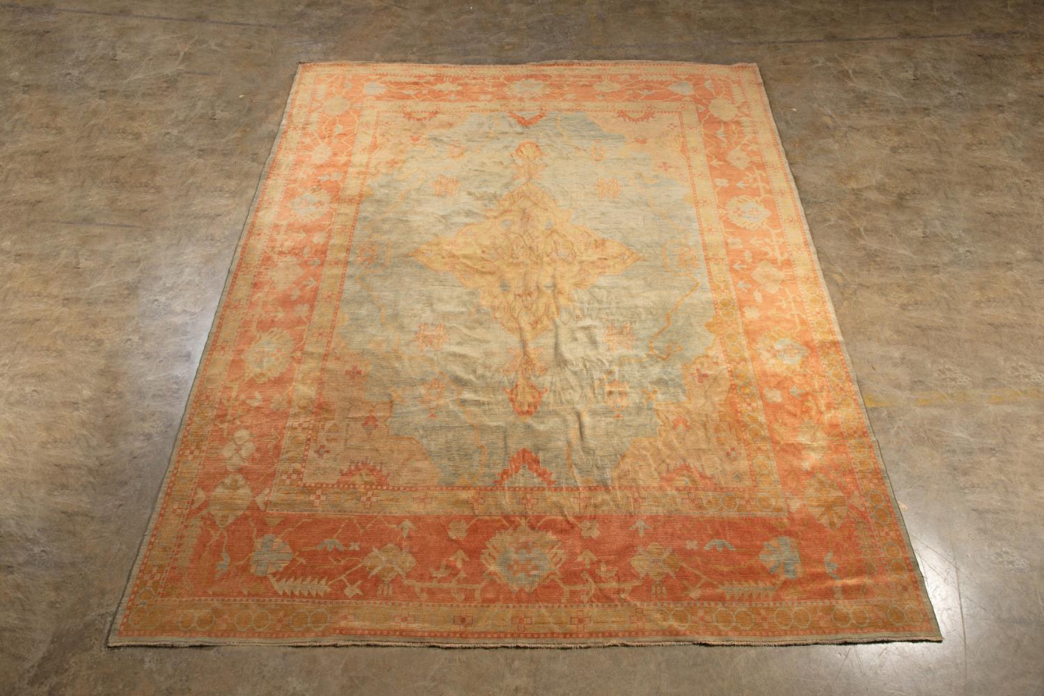 Appraisal: HAND KNOTTED WOOL TURKISH OUSHAK CARPET X Late th or