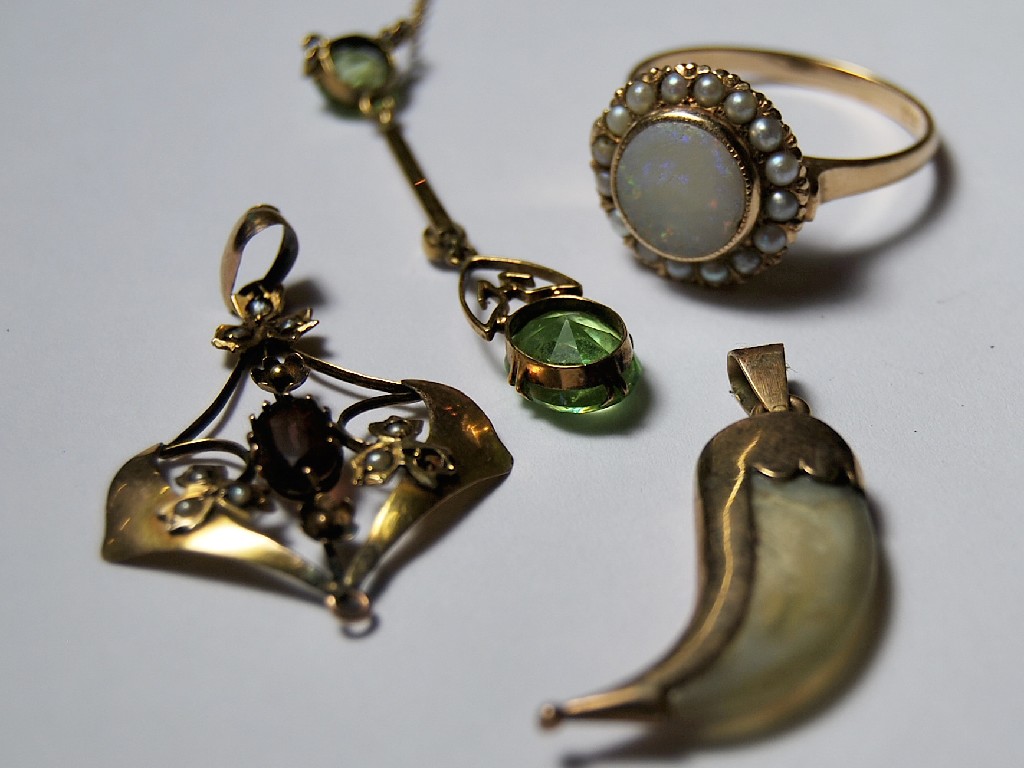 Appraisal: Edwardian peridot and pearl pendant on knife edge bar to