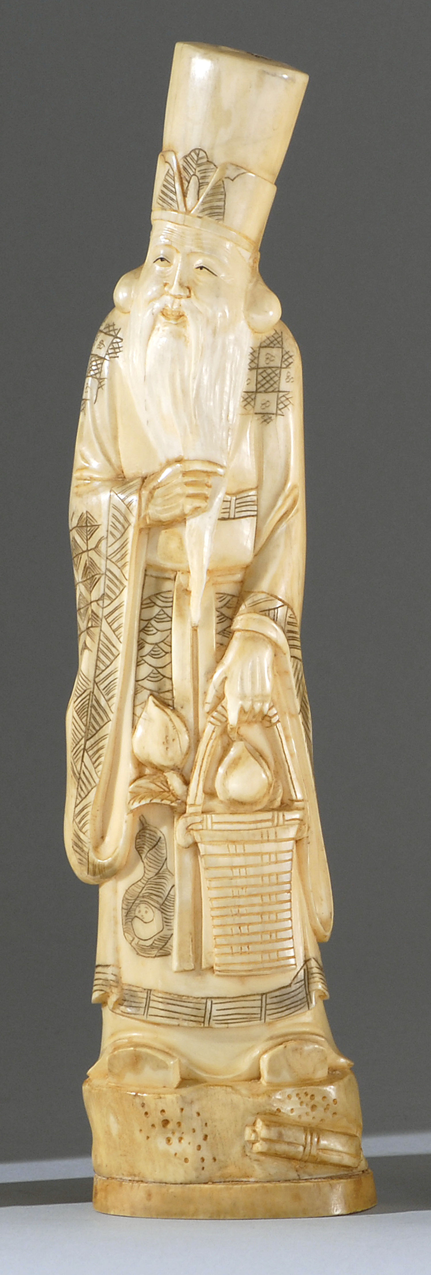 Appraisal: IVORY CARVING Meiji PeriodIn the form of Jurojin standing while