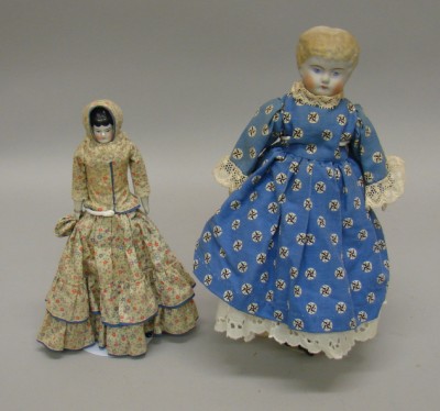 Appraisal: Pair of dolls China Lowbrow with black hair Condition no