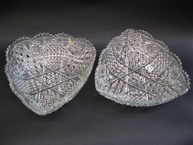 Appraisal: PAIR OF SIGNED CLEAR CUT CRYSTAL BOWLS triangular form heavily