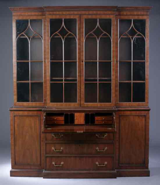 Appraisal: GEORGE III STYLE WALNUT BREAKFRONT CHINA CABINET By Kittinger Furniture