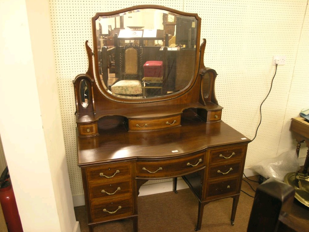 Appraisal: An Edwardian inlaid mahogany dressing table large shield-shaped bevelled plate