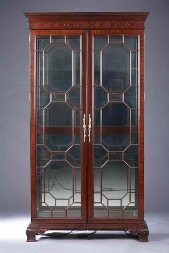 Appraisal: CHIPPENDALE STYLE MAHOGANY VITRINE CABINET Projected molded cornice above pair