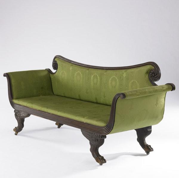 Appraisal: AMERICAN EMPIRE SOFA Upholstered in green silk with claw feet