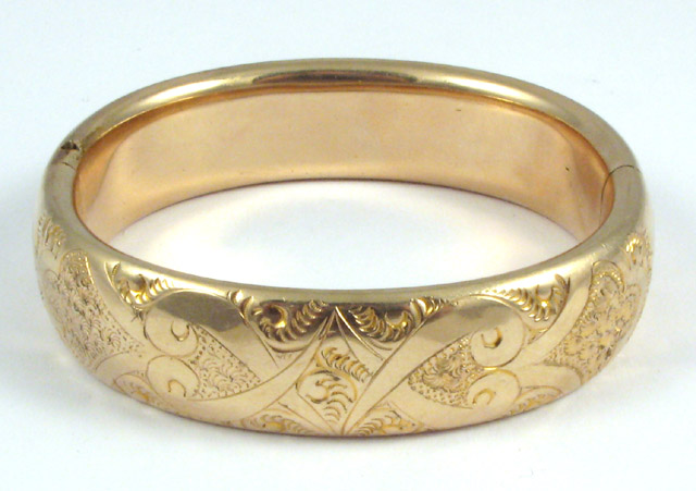 Appraisal: TEN KARAT YELLOW GOLD BANGLE weighing grams