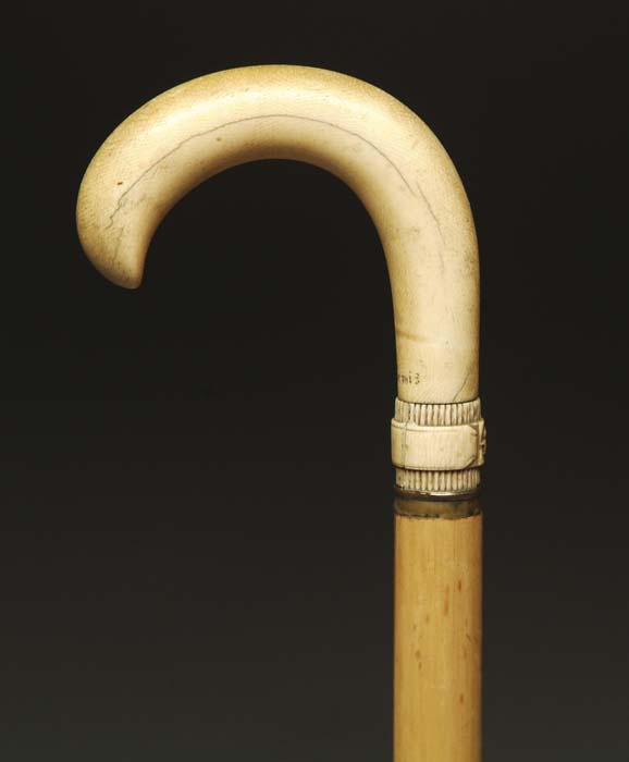 Appraisal: IVORY HANDLED SWORD CANE Bamboo shaft with smooth curved ivory