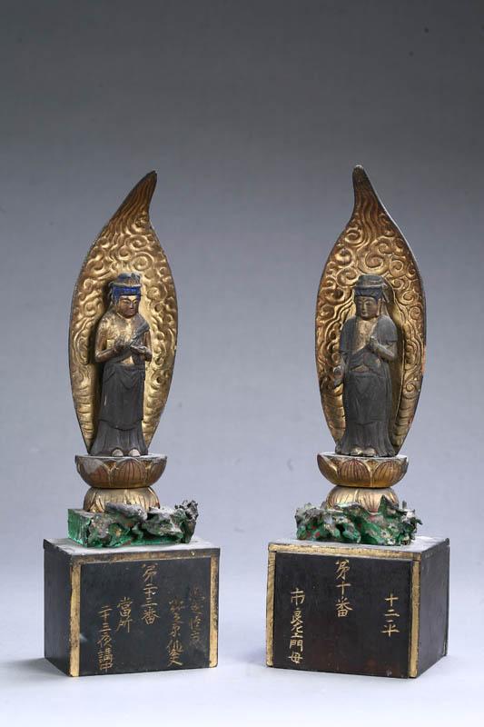 Appraisal: PAIR OF BUDDHA FIGURES Asian carved wood Two robed figures