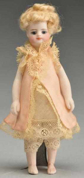 Appraisal: French Bisque Mignonnette Doll with Bare Feet Description French All