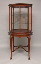 Appraisal: Large Octagonal Vitrine th Century This octagonal vitrine has two