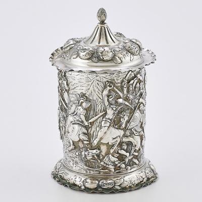 Appraisal: CONTINENTAL SILVER BATTLE MOTIF CANNISTER Cylindrical form chased with concentric