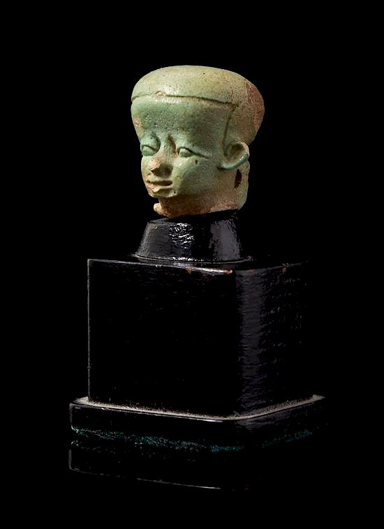 Appraisal: An Egyptian Faience Head of Pataikos Height inches An Egyptian