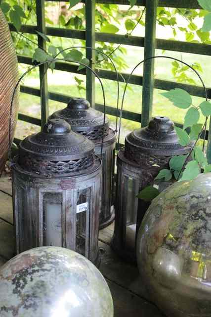 Appraisal: A SET OF THREE WOODEN PIERCED TIN CYLINDRICAL HAND LANTERNS