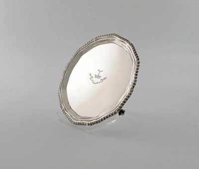 Appraisal: A silver waiter of circular form gadroon border the centre