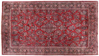 Appraisal: Sarouk rug repeating floral bouquets on burgundy field ft in