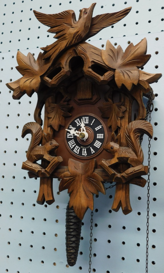 Appraisal: A modern German Black Forest type cuckoo clock carved with