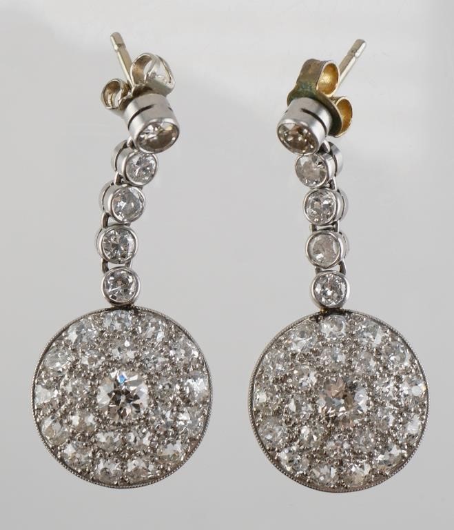 Appraisal: Platinum diamond earrings containing two old cut European round cut