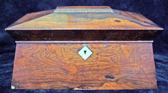 Appraisal: A William IV rosewood sarcophagus shaped tea caddy fitted two