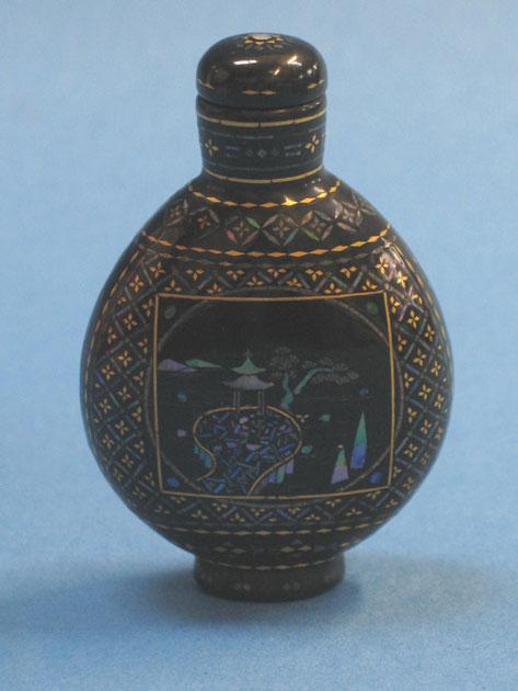 Appraisal: A LACQUE BURGAUTE BOTTLE decorated with a landscape within a