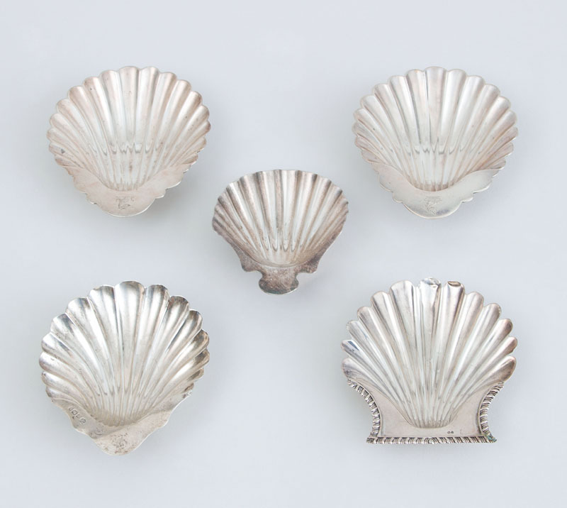 Appraisal: FOUR ENGLISH SILVER BUTTER SHELLS AND A SILVER-PLATED BUTTER SHELLS