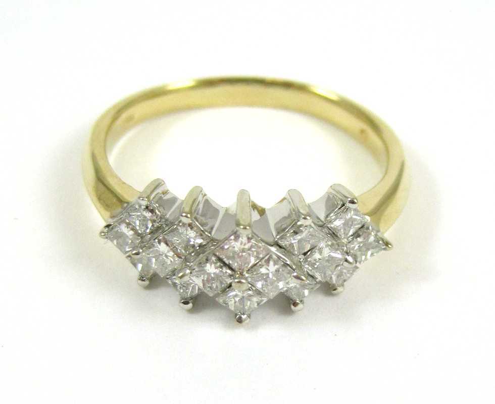 Appraisal: DIAMOND AND FOURTEEN KARAT GOLD RING The yellow and white