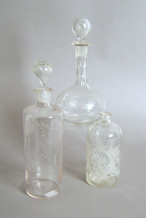 Appraisal: Three etched glass decanters h h and h