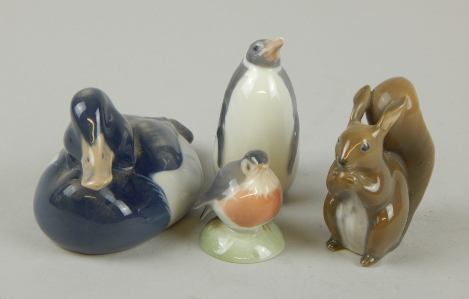 Appraisal: Various Royal Copenhagen figures to include penguin number cm high