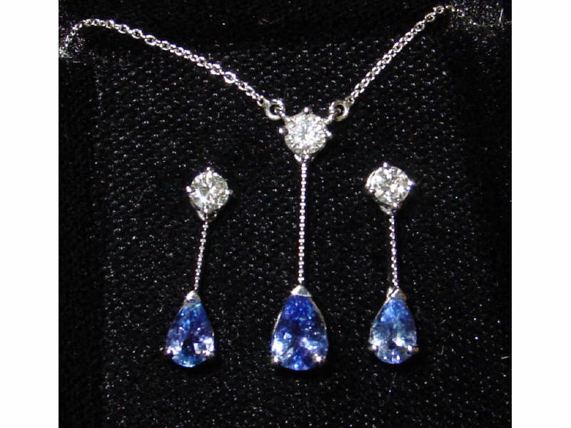 Appraisal: TANZANITE AND DIAMOND PENDANT AND EARRING SET k white gold