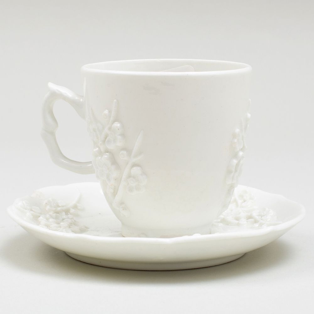 Appraisal: Bow White Glazed Porcelain Coffee Cup and Saucer with Applied