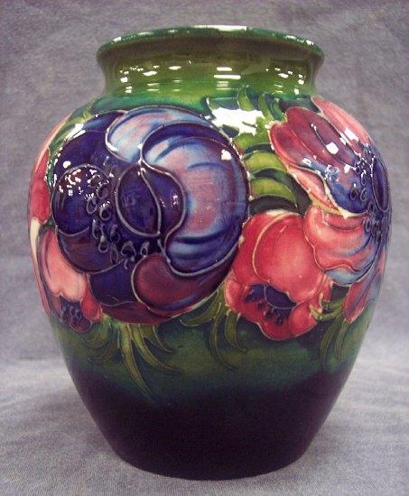 Appraisal: An Anemone pattern spherical vase of green and dark blue