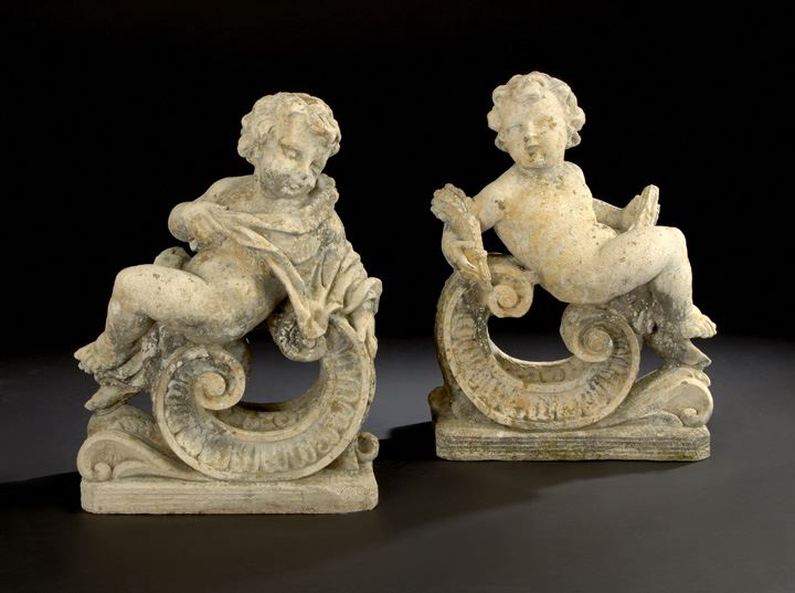 Appraisal: Pair of Cast-Stone Garden Figures in the form of putti