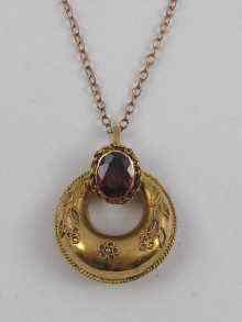 Appraisal: A Victorian yellow metal tests ct gold garnet pendant chain