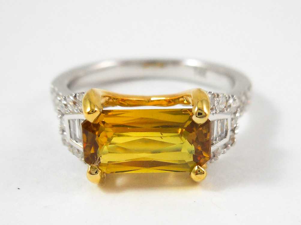 Appraisal: YELLOW SAPPHIRE AND DIAMOND RING with AIGS Gemstone I D