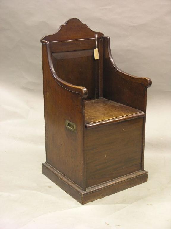 Appraisal: A th century mahogany chair cupboard with arched panelled back