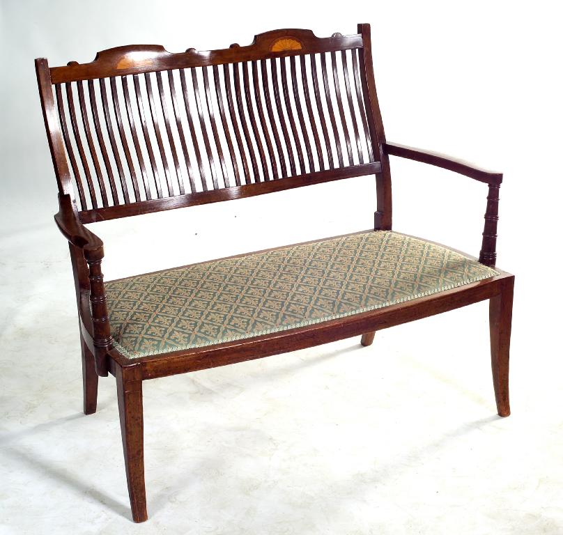 Appraisal: EDWARDIAN INLAID MAHOGANY SETTEE the slatted chair back with paterae-inlaid