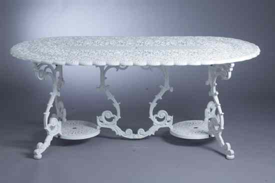 Appraisal: WHITE PAINTED CAST IRON UMBRELLA PATIO TABLE Shaped oval top